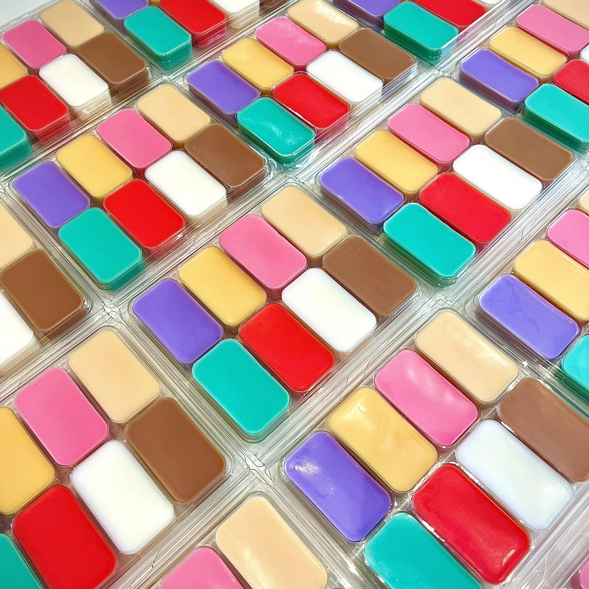 Grid of colorful square wax melts in various colours